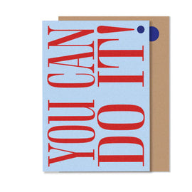 A blue greeting card with the text 'YOU CAN DO IT' in red bold letters, accompanied by a brown envelope.