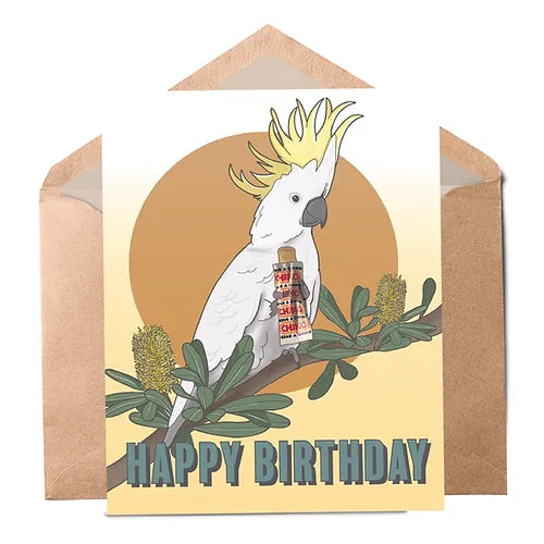A greeting card with a illustration of a white cockatoo on a branch, with the text 'HAPPY BIRTHDAY' and a Chiko Roll snack packet included.