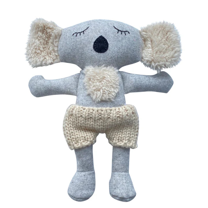 A plush fabric toy resembling a koala bear with gray body and cream-colored knitted pants.