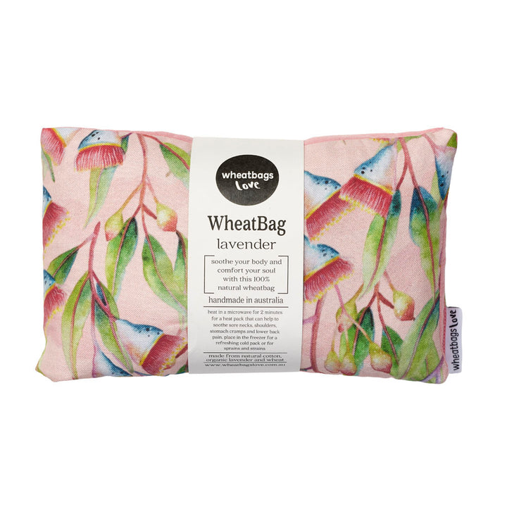 A floral patterned wheatbag with a label indicating it is made in Australia, with a pink background and filled with lavender.