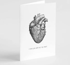 A greeting card featuring a black and white illustration of a human heart with the phrase 'I love you with all my heart' printed at the bottom.