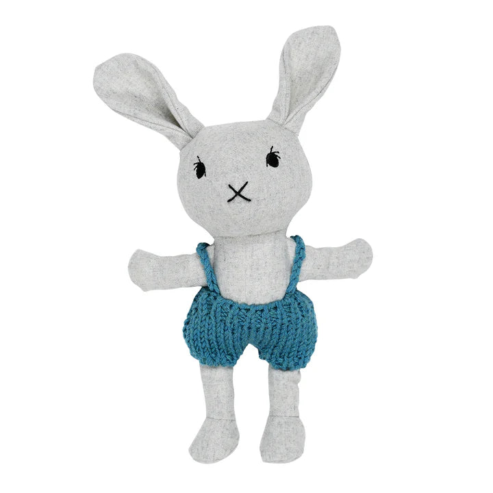 A plush toy of a lionel rabbit with a gray body and blue knitted jumper.