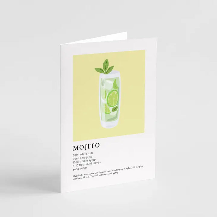 A greeting card with a illustration of a mojito cocktail, featuring a tall glass with lime and mint, on a yellow background with the text 'MOJITO' below it.