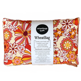 Wheatbag in a bright orange floral print on a plain white background