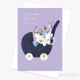 Greeting card with a baby stroller illustration and flowers on a purple background, featuring the text 'welcome little one'
