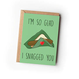 A greeting card with a green background, featuring an illustration of a snag with a heart on the napkin and the text 'I'm so glad I snagged you'.