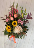 Bouquet of flowers with sunflowers and pink roses on a white background