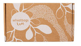 Cardboard box with floral design and 'wheatbags love' text on a white background