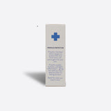 Product packaging with text and a blue cross symbol on a white background