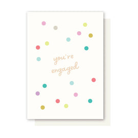Greeting card with colorful dots and 'you're engaged' text on a white background