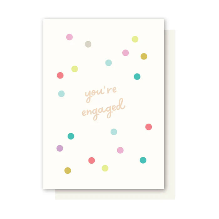Greeting card with colorful dots and 'you're engaged' text on a white background