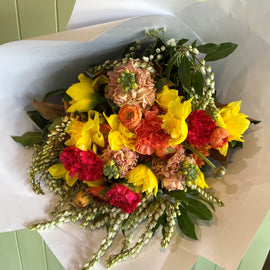 Bouquet of colorful flowers on a light green background