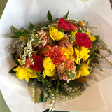 Bouquet of colorful flowers on white paper