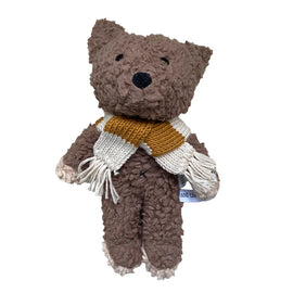Fluffy chocolate dog stuffed toy with a knitted striped scarf