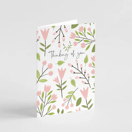 Floral card with 'Thinking of you' text on a light gray background