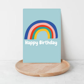 an image of a greeting card that has happy birthday on it along with a bright coloured rainbow.  Perfect for  a personal message for a fun, vibrant birthday celebration.