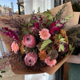 Bouquet of native flowers with pink, burgundy and rust tones
