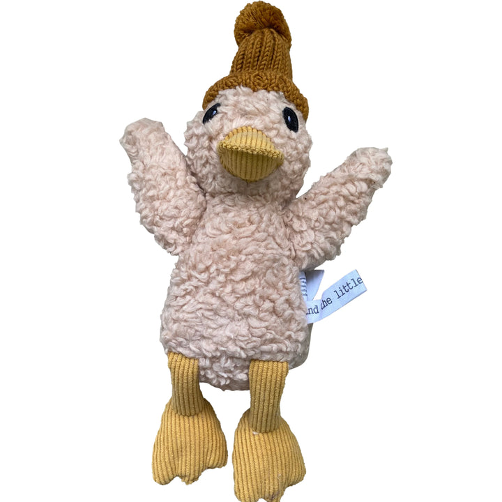 Plush duck toy with a knitted hat on a white background