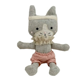A plush fabric toy designed to resemble a cat, with soft brown coloring and a tulle neck frill, wearing pink bloomers.
