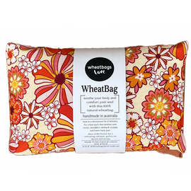Wheatbag in a bright orange floral print on a plain white background