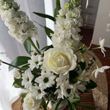 White flower arrangement with rose