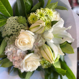 Bouquet of flowers with green and white tones on a white background