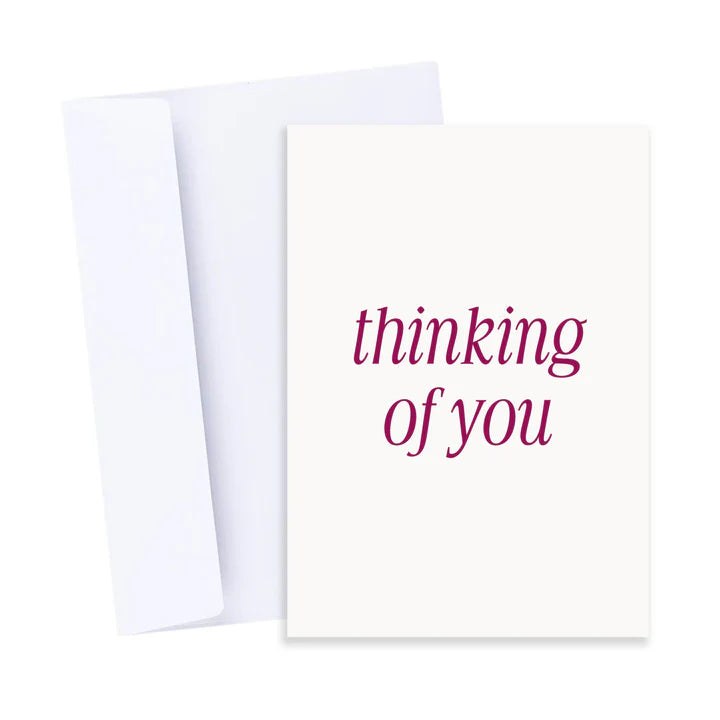 White card with 'thinking of you' text on a white background