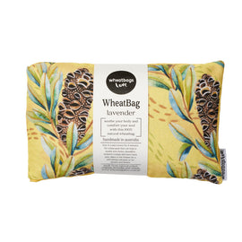 A yellow wheatbag with floral patterns, including a label that reads 'WheatBag' and 'lavender', indicating it is made in Australia.